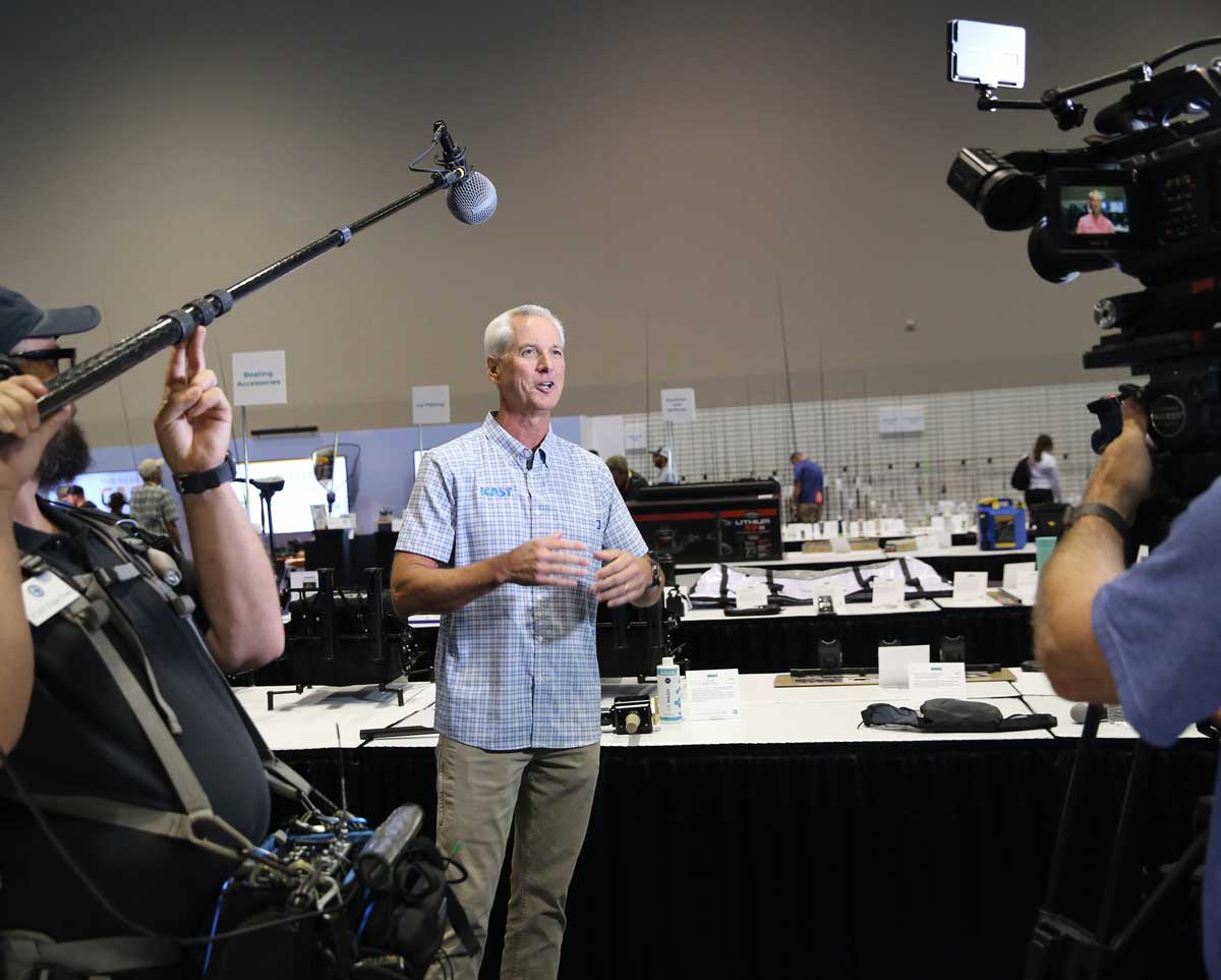 glenn-speaking-to-media